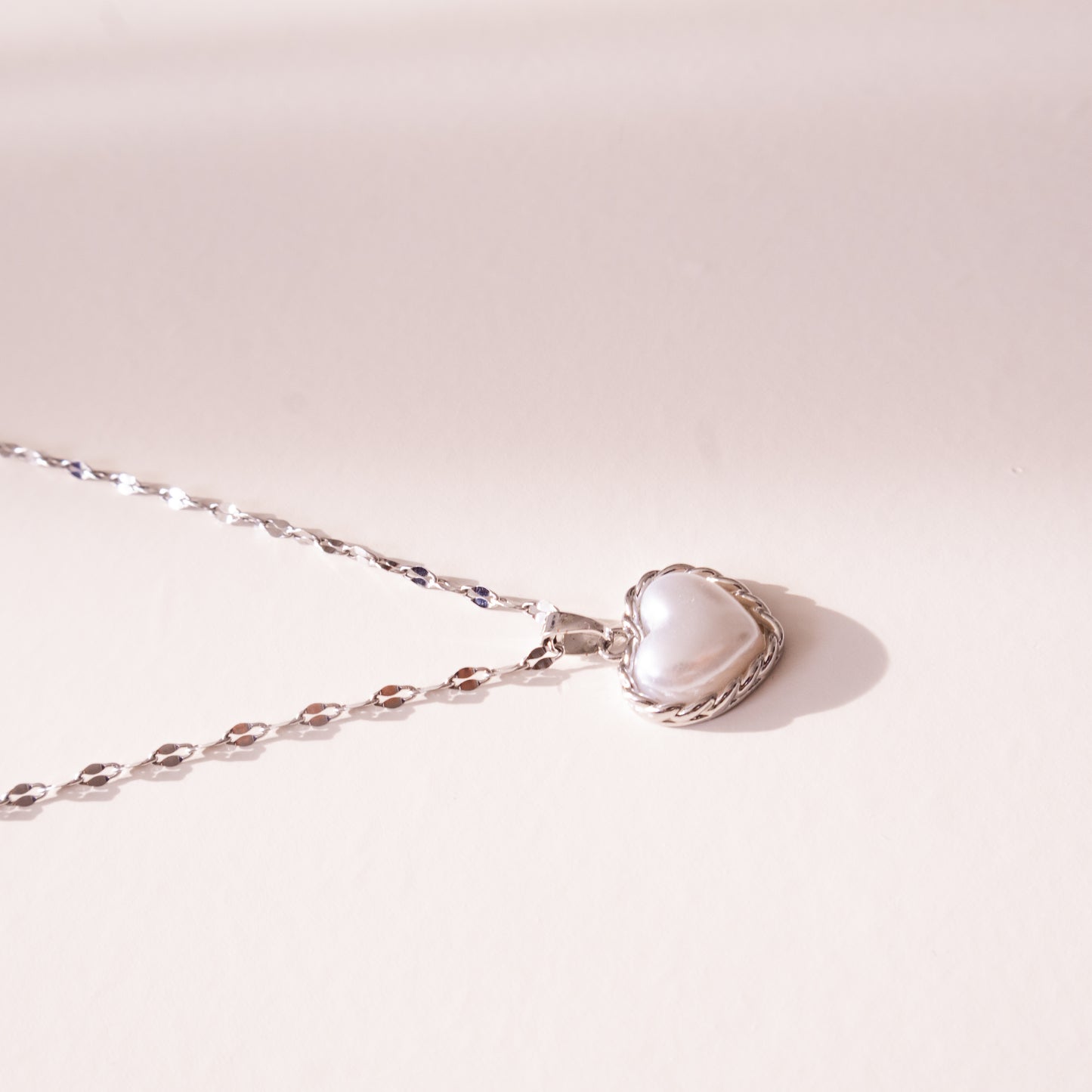 Bound Twisted Silver Heart Pendant Necklace