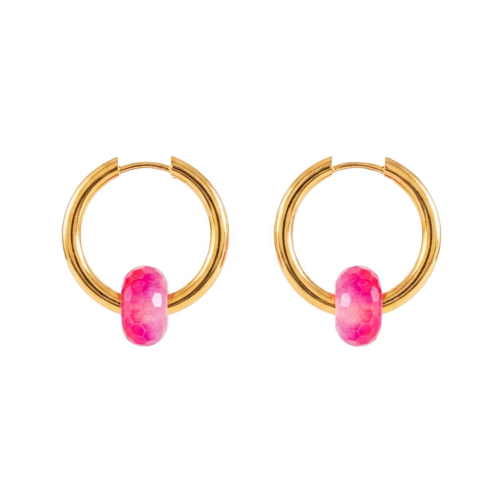 Gold hoop earrings with pink gemstones on a white background