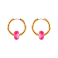 Gold hoop earrings with pink gemstones on a white background