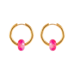 Gold hoop earrings with pink gemstones on a white background