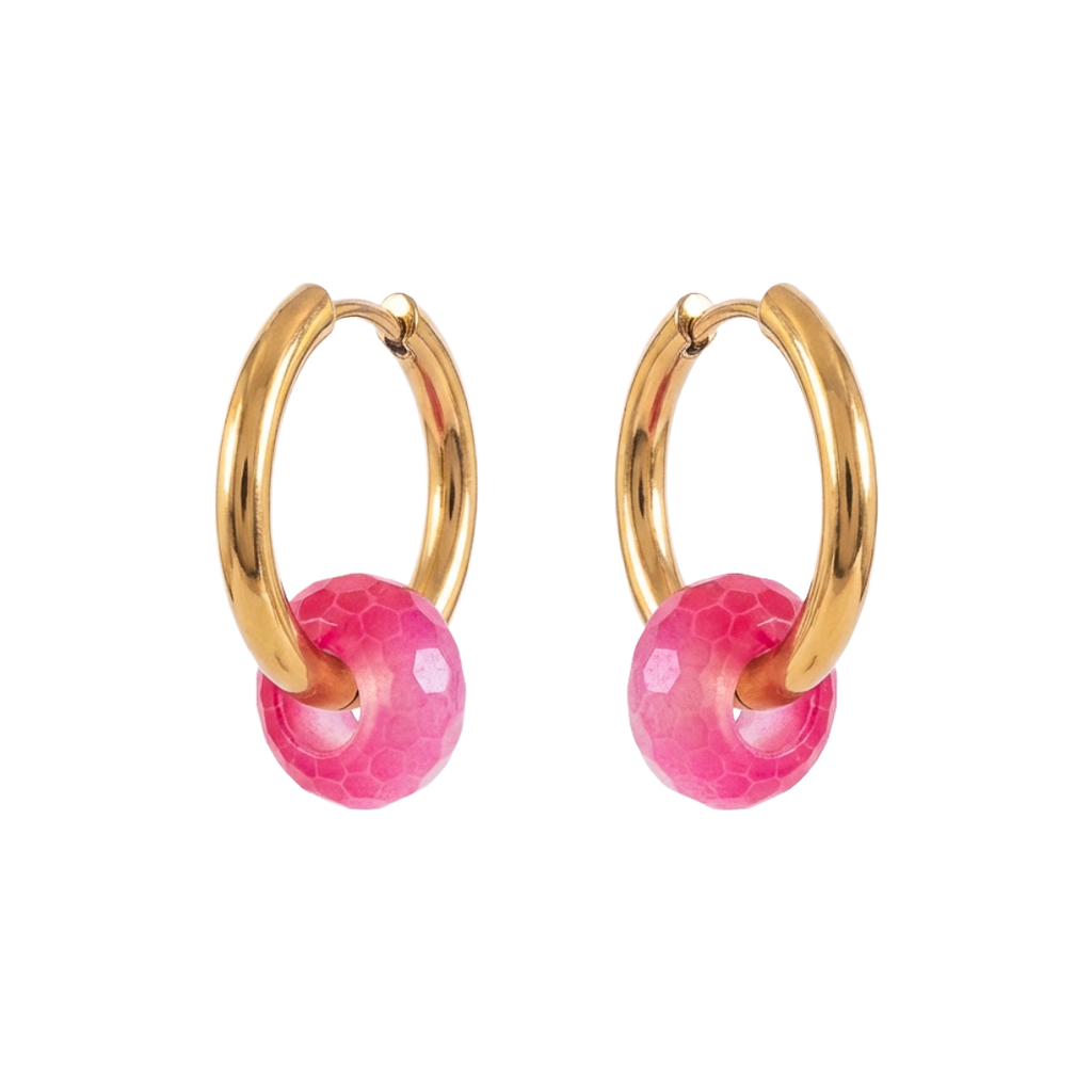 Gold hoop earrings with pink spherical charms on a white background