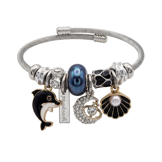 Silver bracelet with various charms including a dolphin, pearl, and shell on a white background