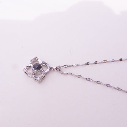 Silver necklace with a pendant on a white background