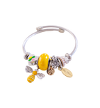 Bracelet with bee charm and other beads on a white background