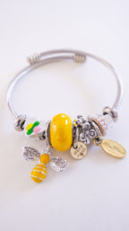 Silver bracelet with colorful beads on a white background