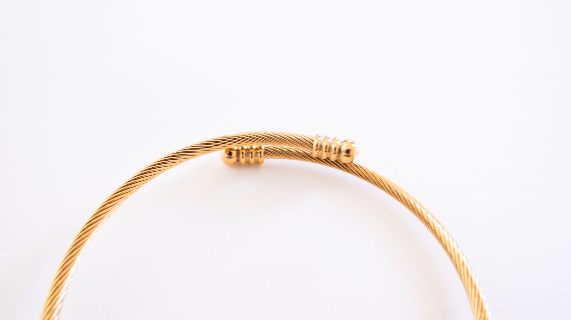Gold bracelet on a white background
