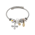 Silver bracelet with various charms on a white background