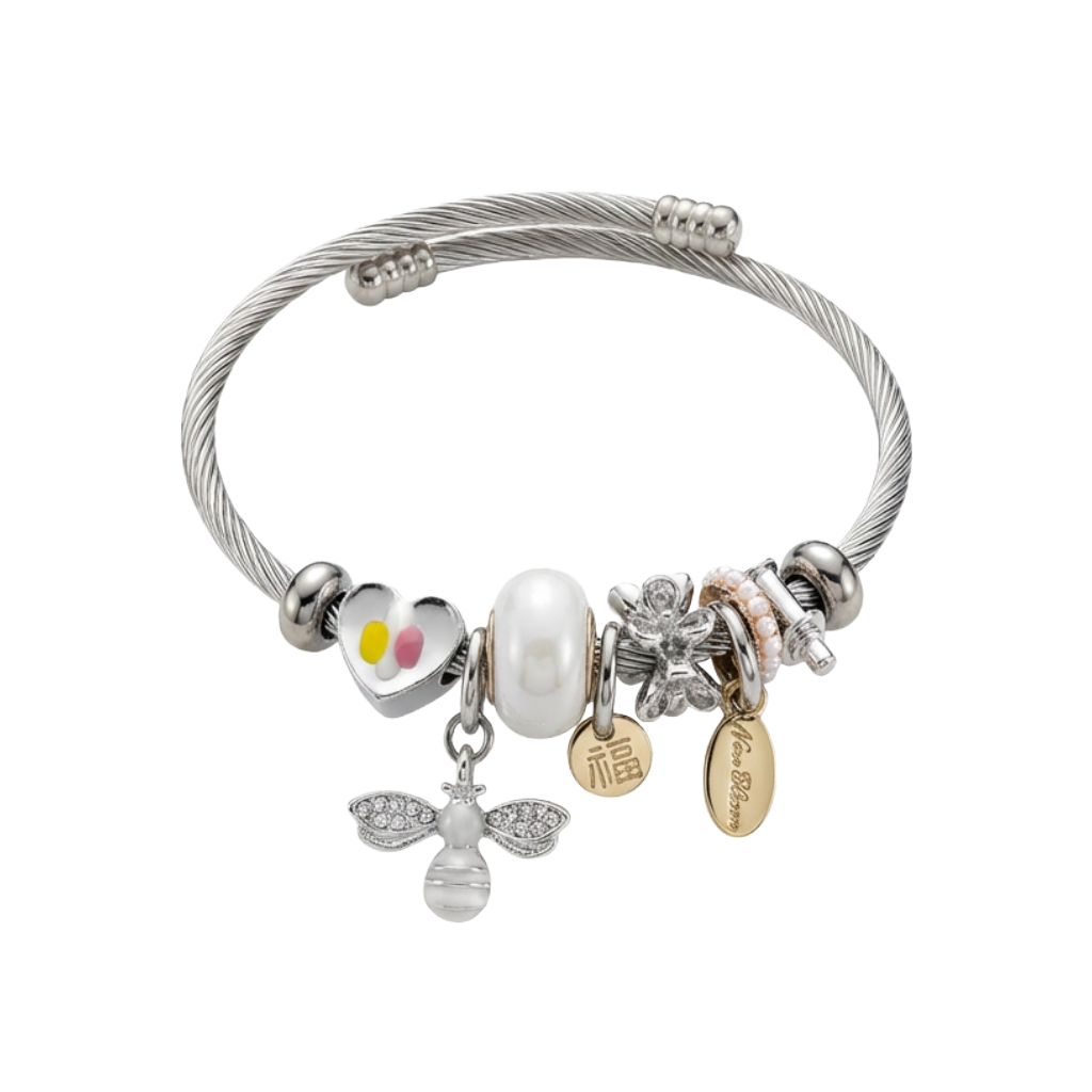 Silver bracelet with various charms on a white background