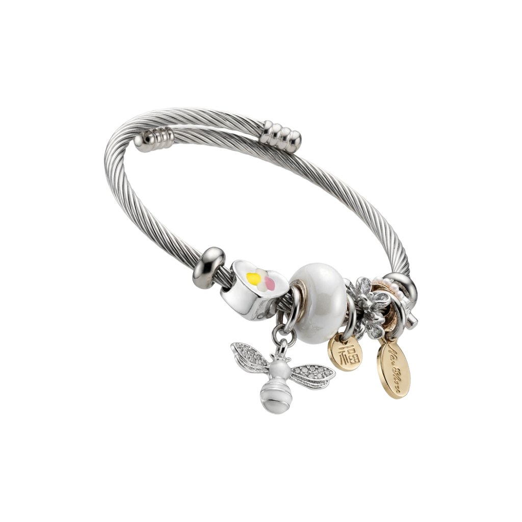 Silver bracelet with various charms on a white background