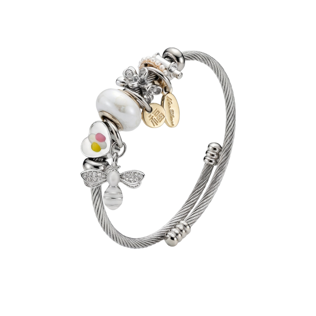 Silver bracelet with various charms on a white background