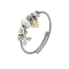 Silver bracelet with various charms on a white background