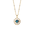 Gold necklace with a blue gemstone pendant on a white background