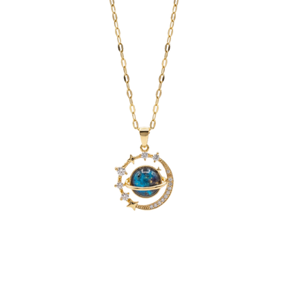 Gold necklace with a blue gemstone pendant on a white background