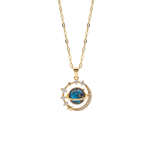 Gold necklace with a blue gemstone pendant on a white background