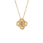 Gold necklace with a circular pendant on a white background