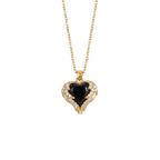 Gold necklace with a heart-shaped black gemstone pendant on a white background