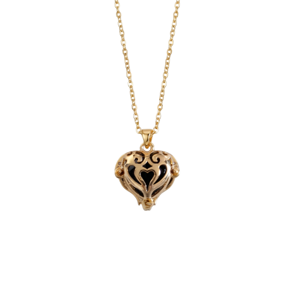 Gold heart-shaped necklace on a white background