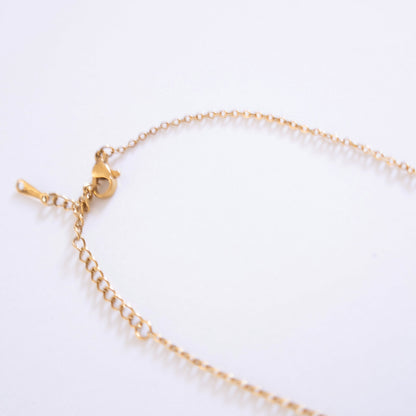 Gold bracelet on a white background