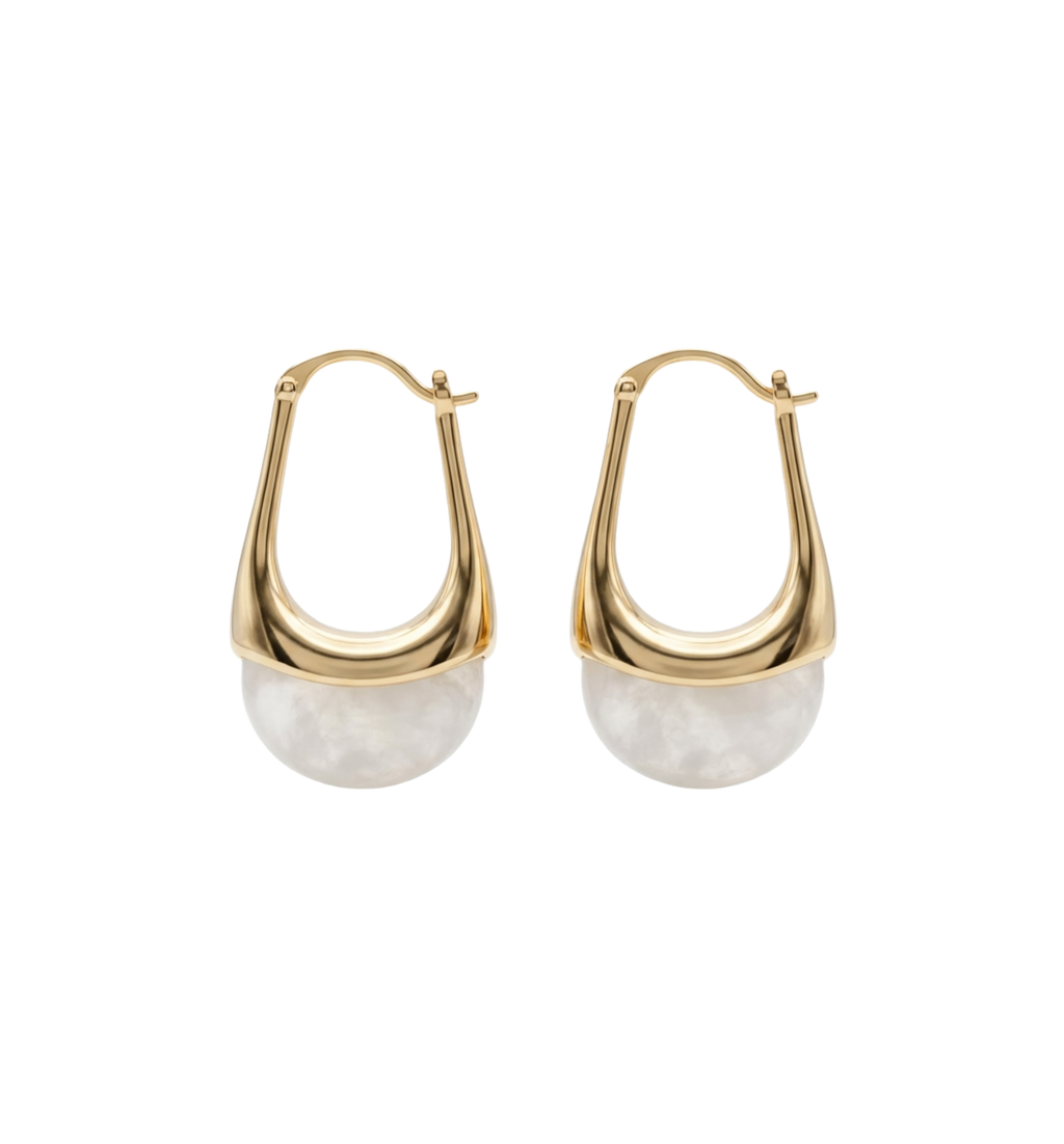 Gold hoop earrings with white stone beads on a white background