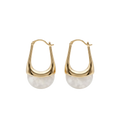 Gold hoop earrings with white stone beads on a white background